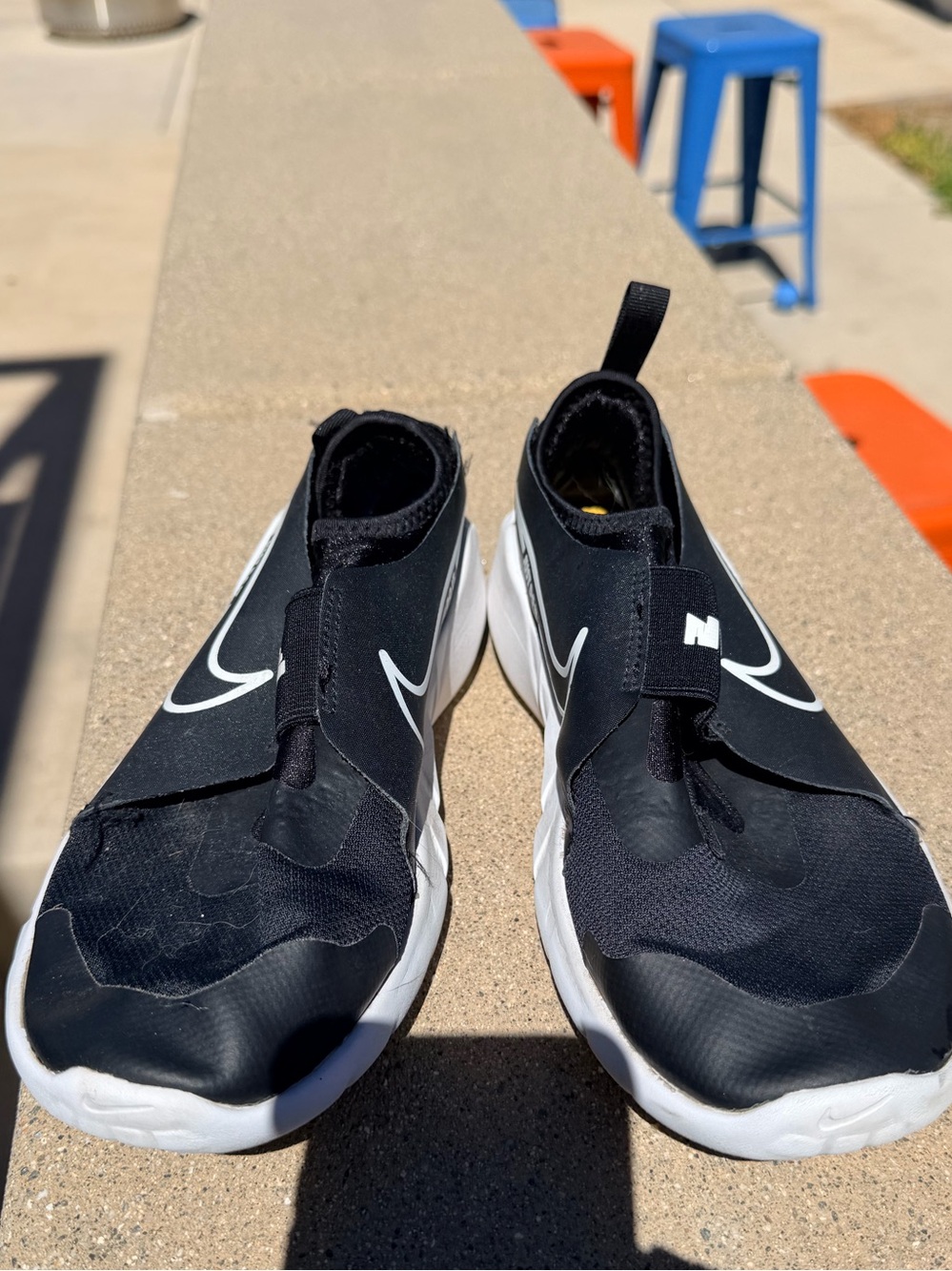 Nike Black and White Slip-On Sneakers